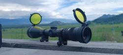 Trijicon AccuPoint TR22-2G (2.5-10x56, Mil-Dot Green) на стальных кольцах Trijicon 